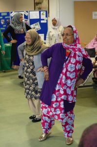 Two ladies dancing at Dhek Bhal workshop